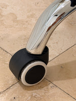 Load image into Gallery viewer, Close-Up of Caster Wheel on Chrome Office Chair Base

