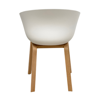 Side profile of grey upholstered Scandinavian dining chair