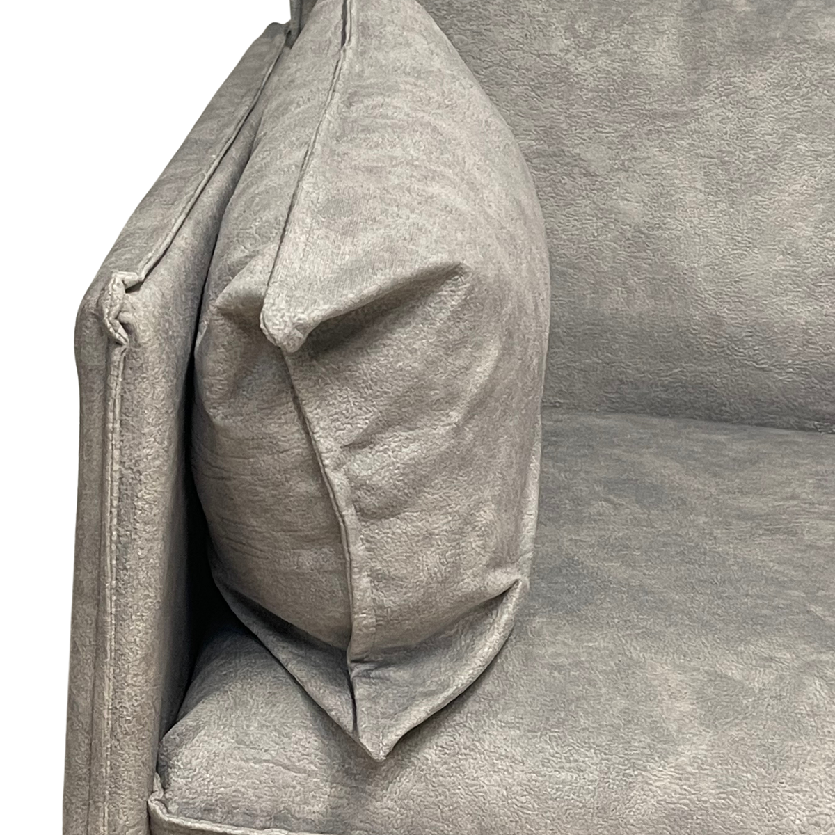 Close-up view of soft plush side cushion and premium grey fabric upholstery on modern office sofa