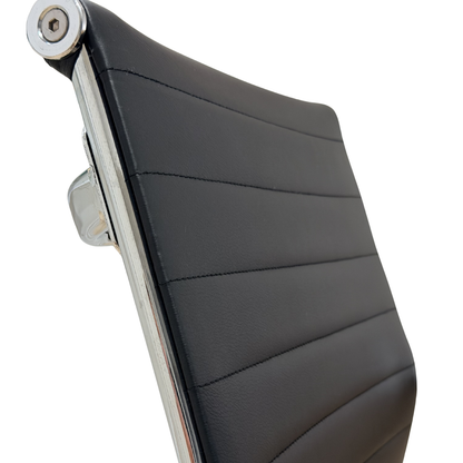 Detailed view of padded chrome armrest and soft front seat cushion edge