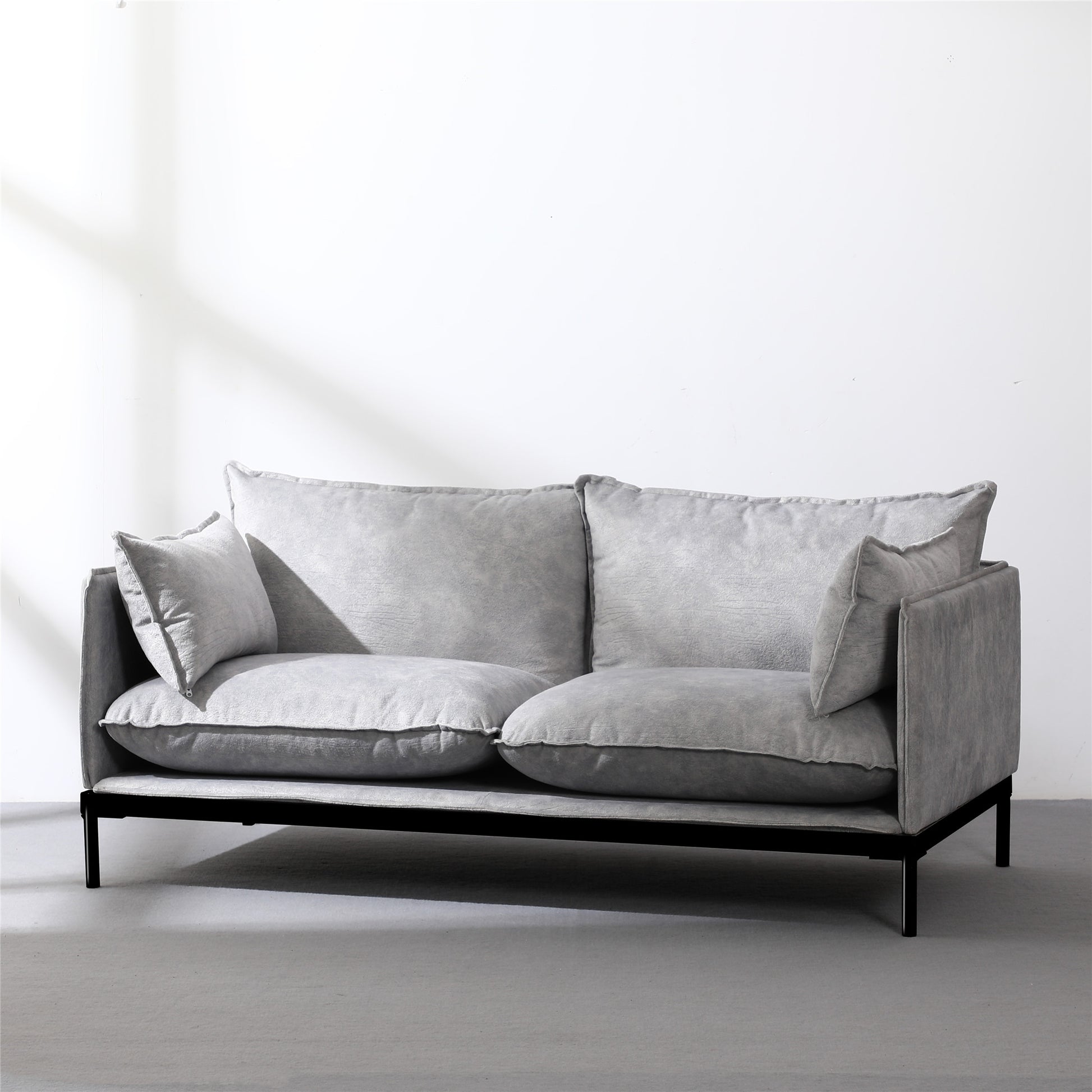 Modern grey fabric 2-seater office waiting room sofa with sleek black metal frame and plush cushions