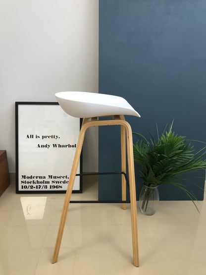Nordic counter stool styled beside a modern kitchen island